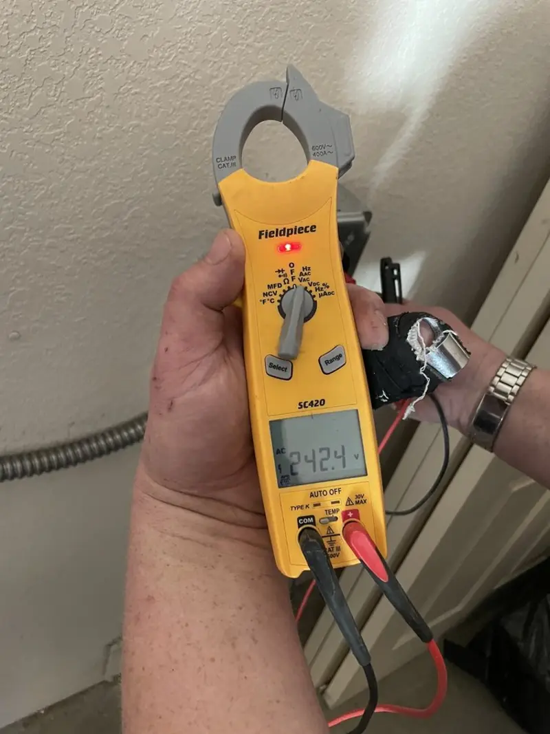 Voltage testing with clamp meter during Ceiling Fan Installation in Poestenkill
